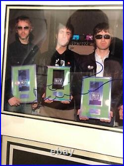 Genuine Oasis signed photographs by Liam and Noel Gallagher, Framed with COA